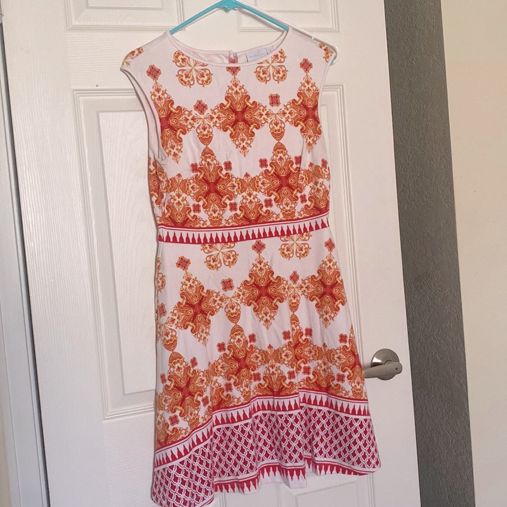 Fun and flattering sleeveless dress is perfect for a graduation or any event